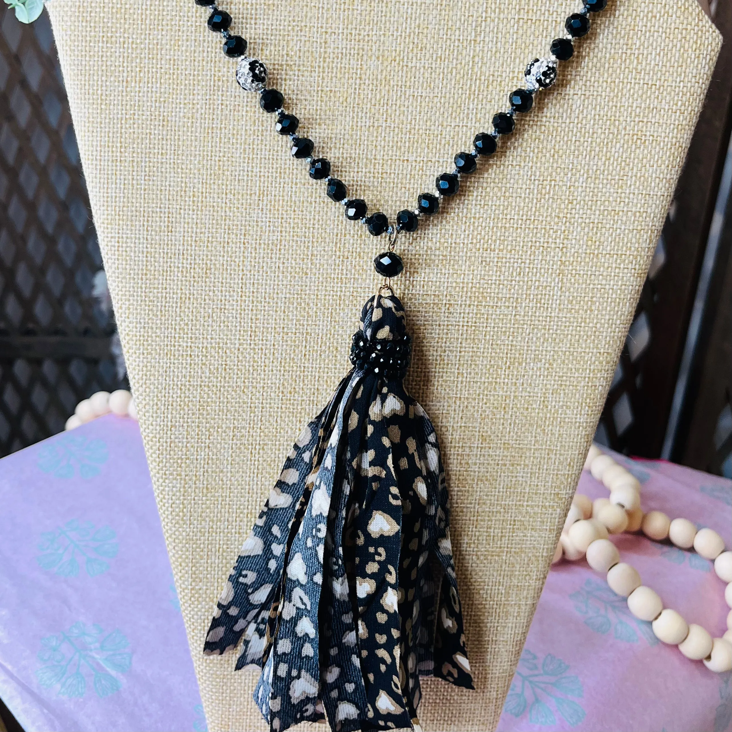 long beaded chain tassel necklace: black and brown w/ leopard bead